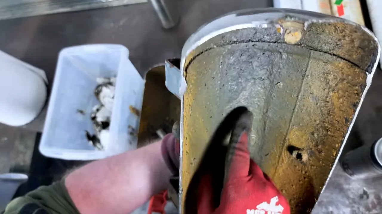 Corroded interior wall of an opened air compressor tank