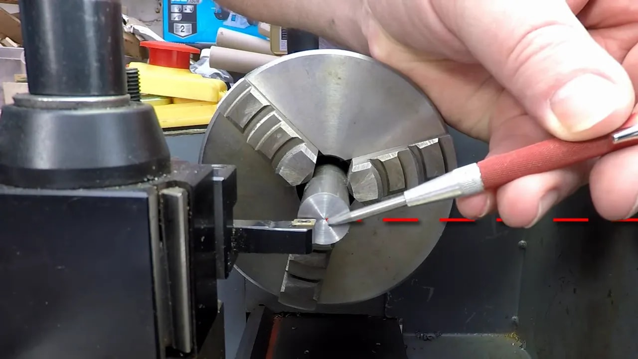 Close-up of caliper depth probe measuring lathe tool height from top of bar to cutting edge