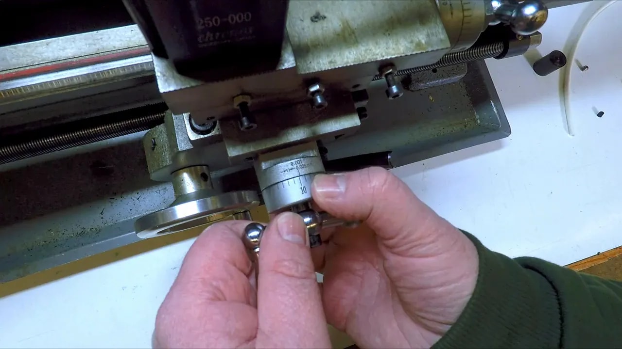 Close-up of mini lathe friction dial grub screw compressing the dial mechanism