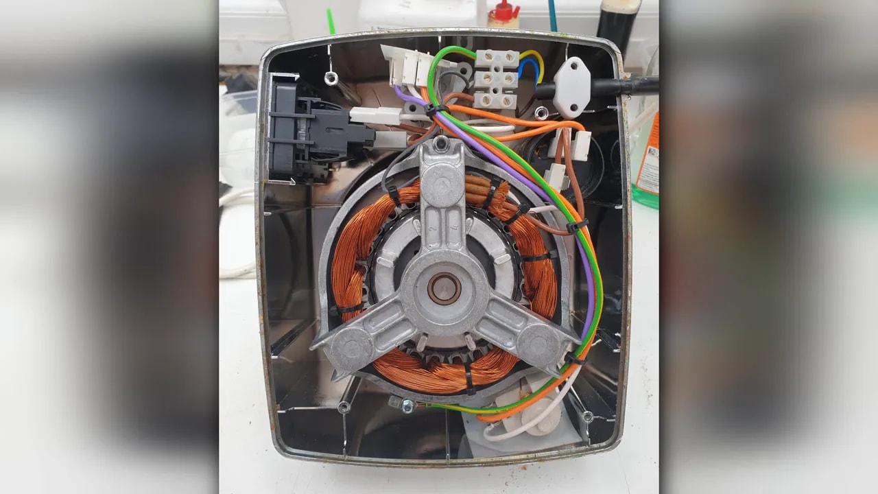 Exposed mixer motor showing stator windings and rotor removed from a food processor