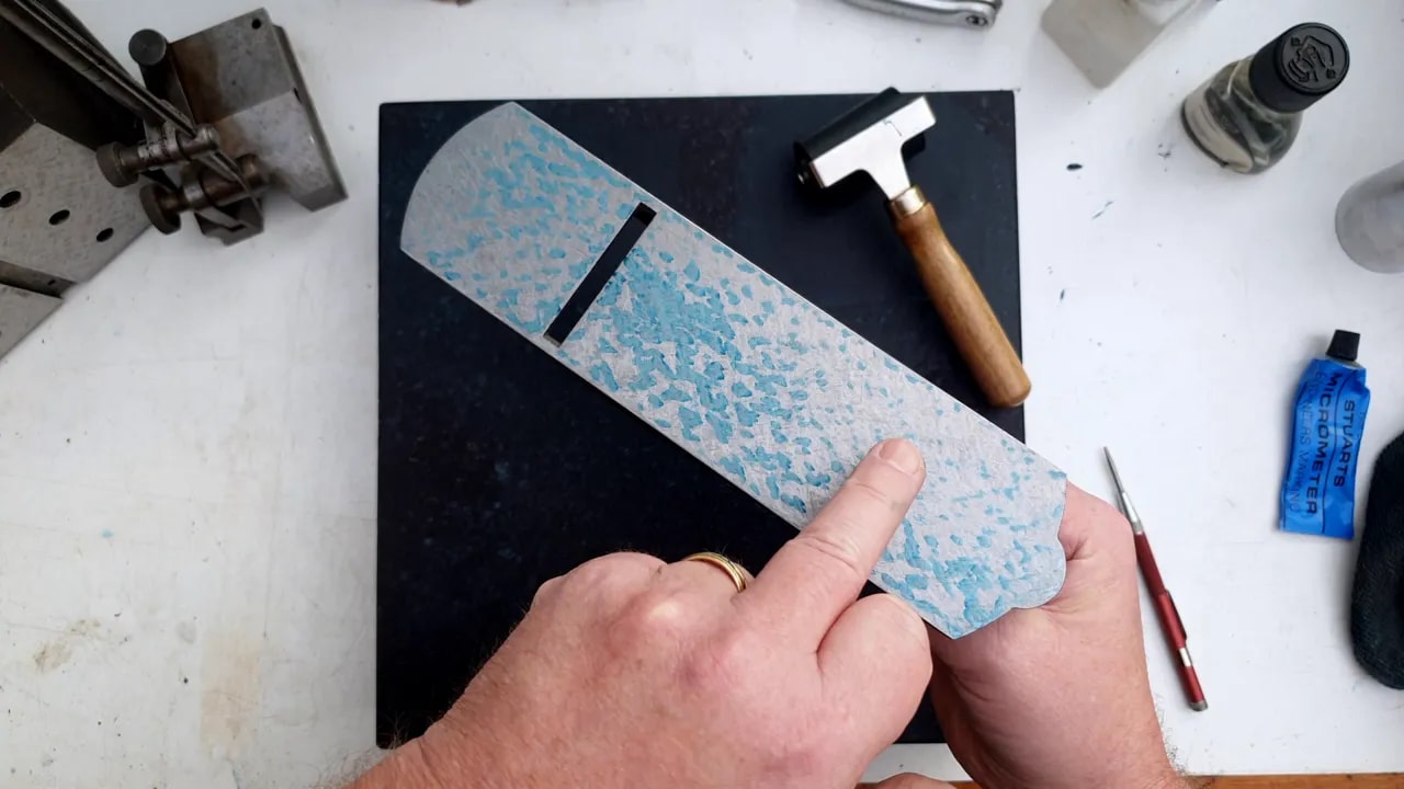 Plane sole with marking blue over a surface plate showing contact pattern and variability