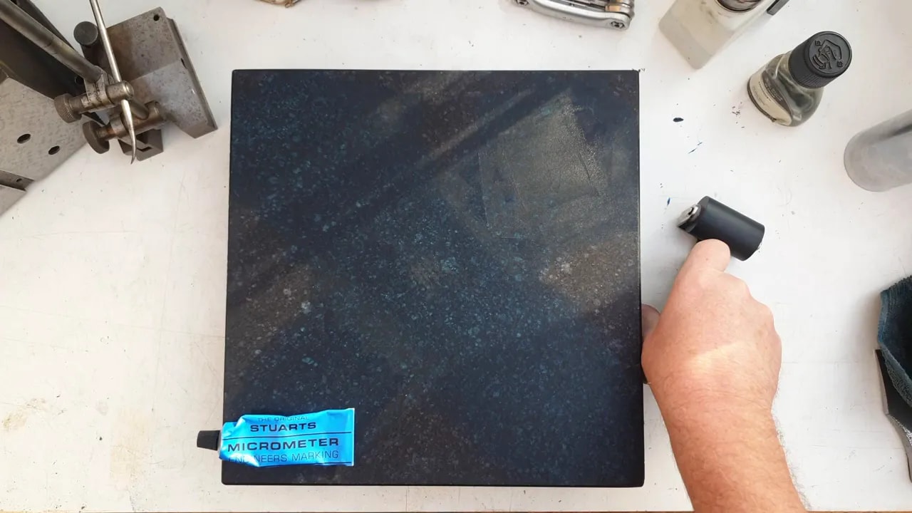Marking blue applied for precision surface plate flatness testing on a wood plane sole