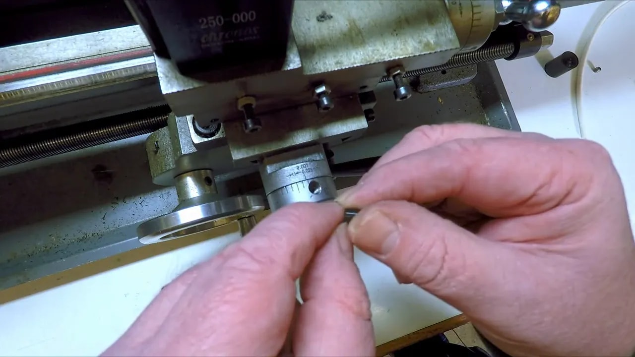 Seating the compression plug into the friction dial hole on a mini lathe
