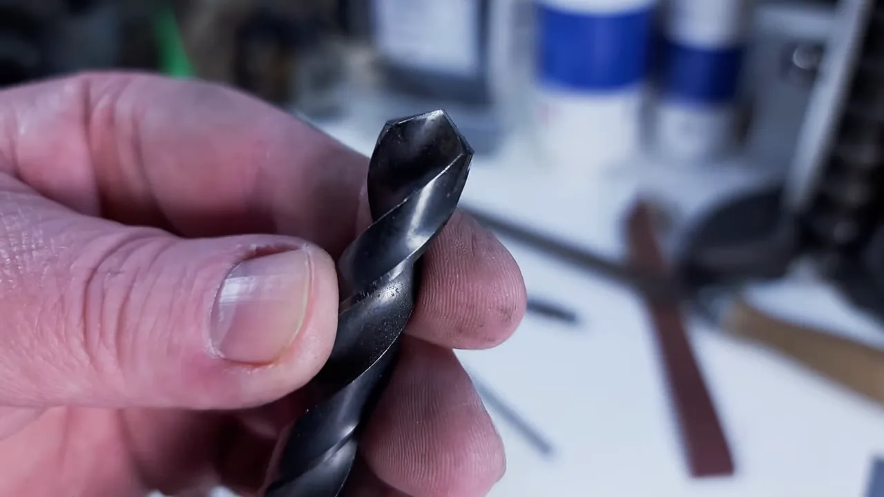 Close-up of twist drill bit tip after hand sharpening