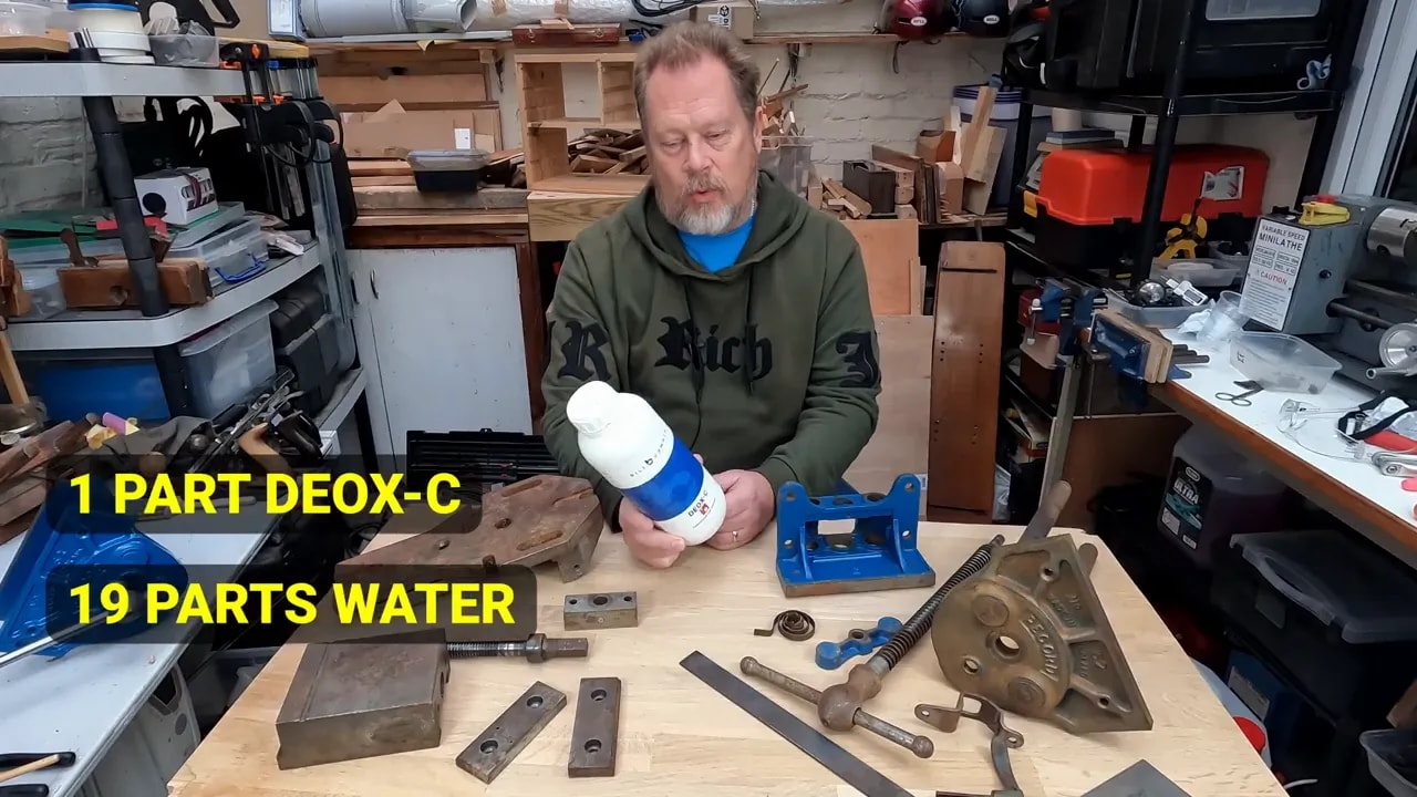 On-screen text showing one part Deox-C to nineteen parts water gives a five percent solution