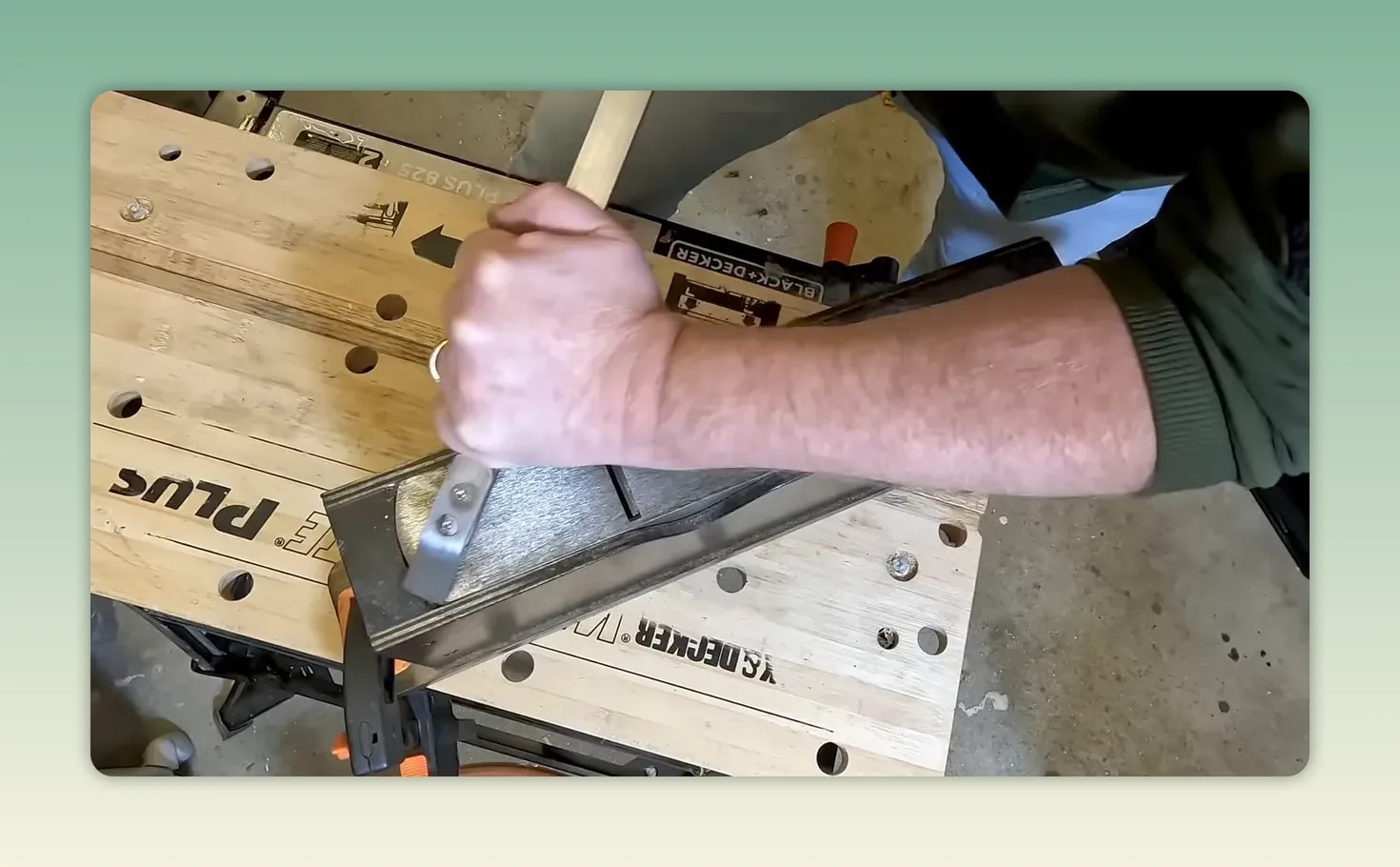 Hand scraper removing marked high spots from the sole clamped in a wooden shoe