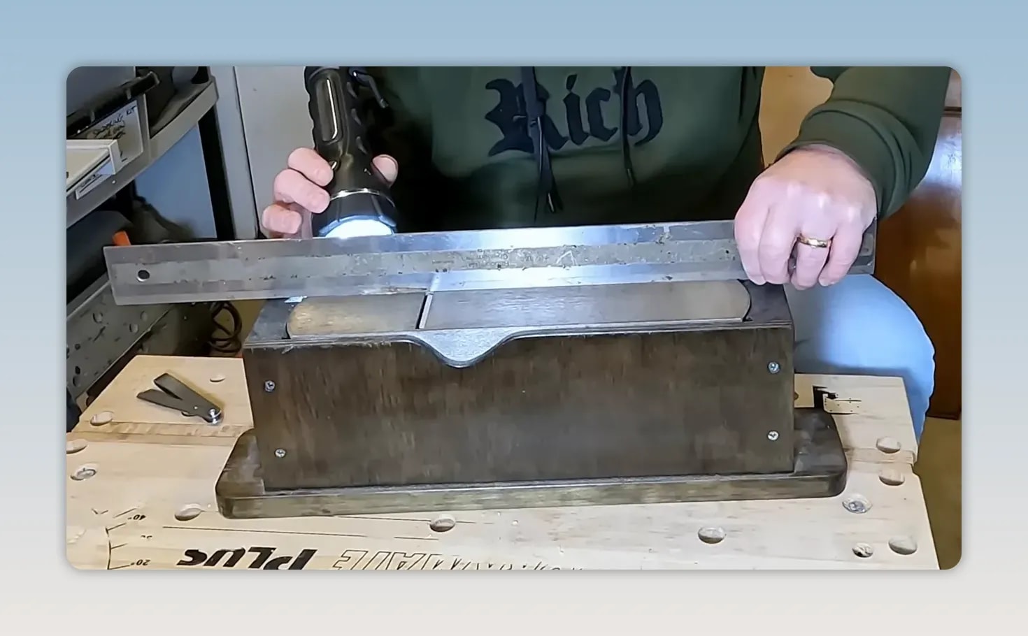 Straight edge over the plane sole with a torch shining beneath it